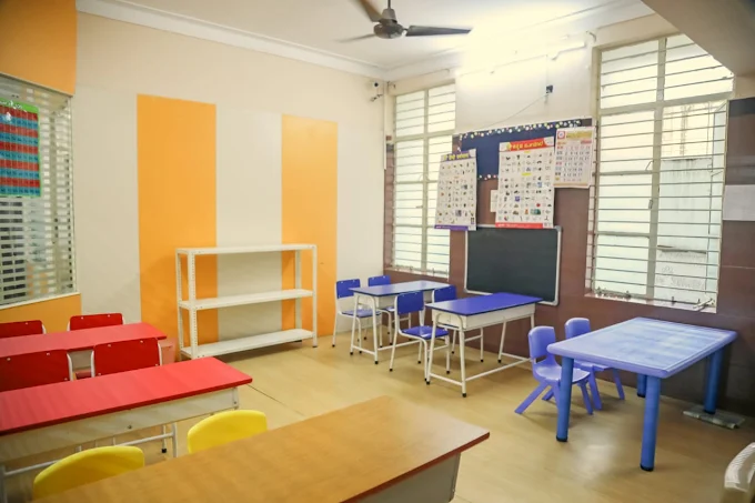 Bright, colourful classroom with activity tables