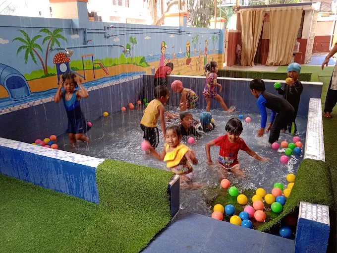 Kids splashing in rain-shower ball pit