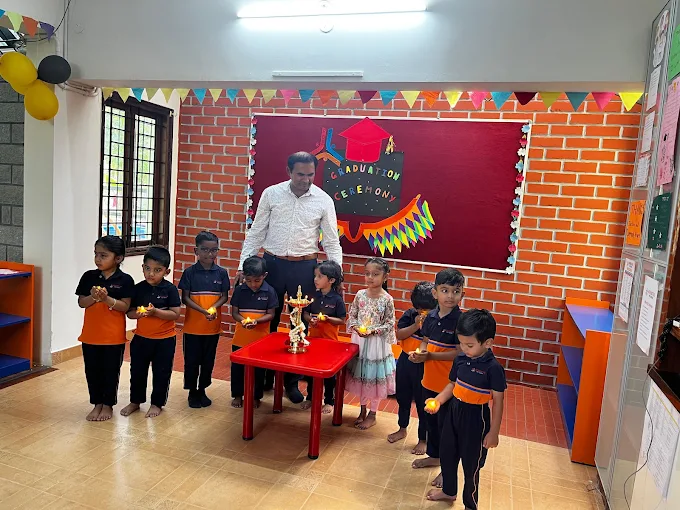 Graduation ceremony lamp-lighting with teacher